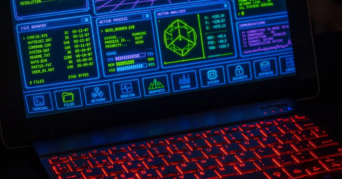 Interface numérique futuriste affichée sur un écran d'ordinateur portable avec clavier rouge néon.
